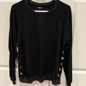 Michael Lauren black sweatshirt with metallic silver stars down the sides.